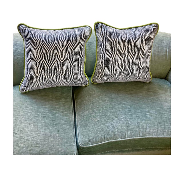 This is a pair of Decorators pillows mad3e from Quadrille blue and white Zig Zag fabric with lime green leather cord trim....