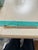 This authentic Tiffany & Co. bread knife features an elegantly sculpted loop-style sterling silver handle paired with a...