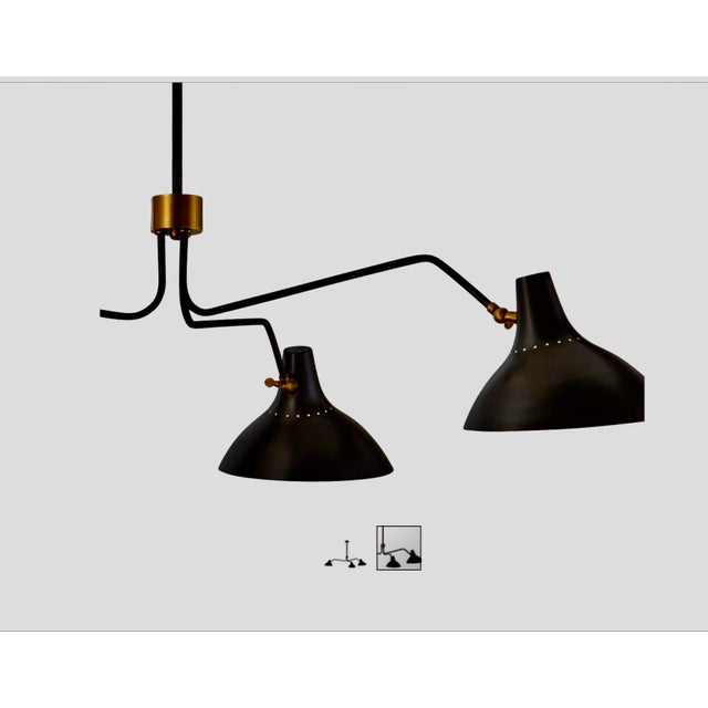 Perfect condition. 3 light large chandelier has a stylish, contemporary feel. With three sleek, movable shades on long,...