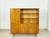 This elegant mid-century living room cabinet from the 1960s captivates with its exceptional walnut veneer featuring a...