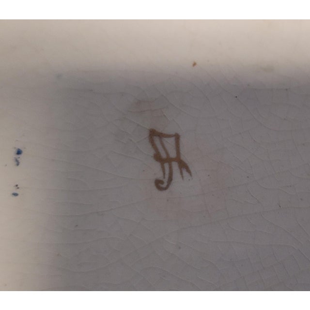 A beautiful pair of English antique Faience vases in the Chinoiserie style. Each vase features raise gilted design hand-...