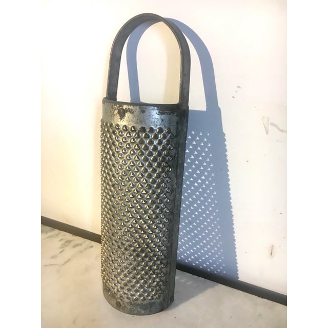 This large Victorian era grater is sturdy and solidly made. Dimensions: 14” x 4.25” x 2.25” 0.26