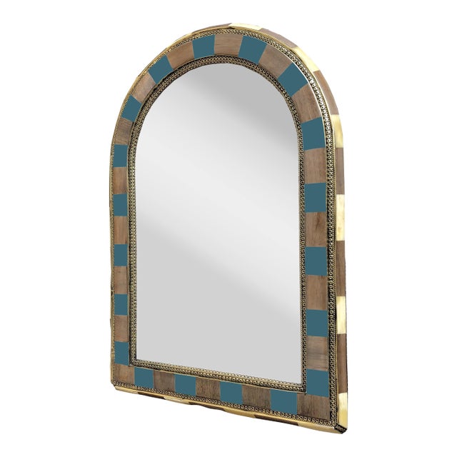 Add a touch of artistic sophistication to your space with this unique handcrafted wall mirror, blending warm natural...