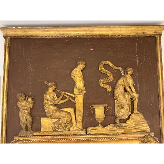 93" tall antique Inch tall mirror with trumeau style classical motif. Distressed red background with beautiful crusty gold...