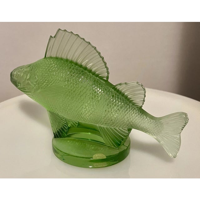 Elegant and timeless, this vintage Lalique green crystal perch fish figurine is a beautiful example of classic French...