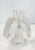 Graceful frosted glass figurine molded as two doves perched on a stylized leaf covered stem with their heads turned in the...