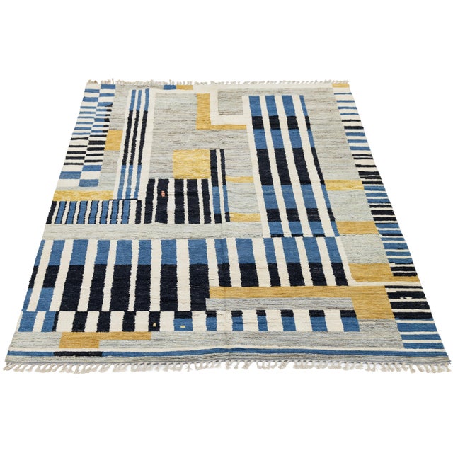 Add a touch of contemporary artistry to your space with this stunning Modern Moroccan-style wool rug. Featuring a bold,...