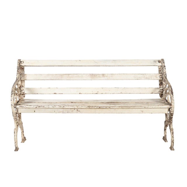 This Vintage Anglo-Indian Painted Teakwood and Cast-Iron Garden Bench features solid teakwood slats finished in layers of...
