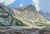 Erosion by Judd Mercer | Oil on panel Landscape of mountains and a lake under a blue sky For Sale