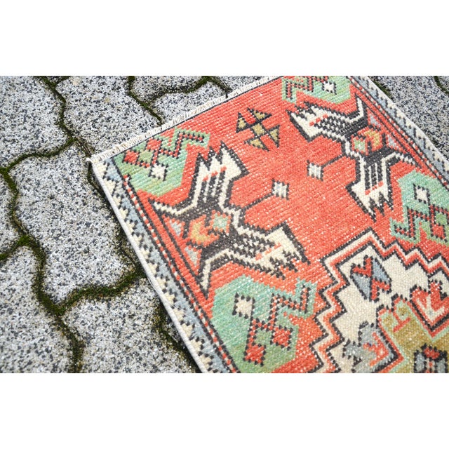 This is a vintage Turkish Oushak rug from the 1960s. The piece was hand-knotted.