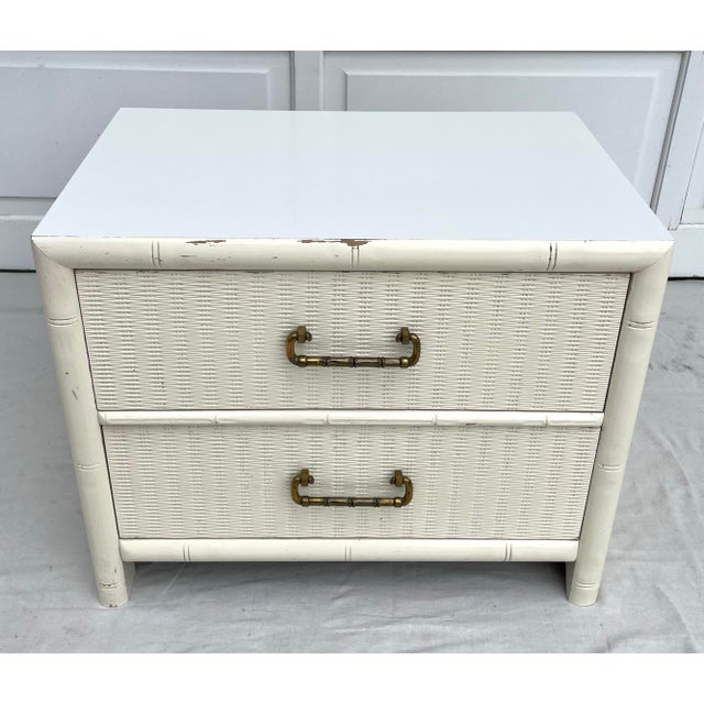 Here is a wonderful, mid-century piece that features a faux bamboo wood carved border detail and great textured drawers...