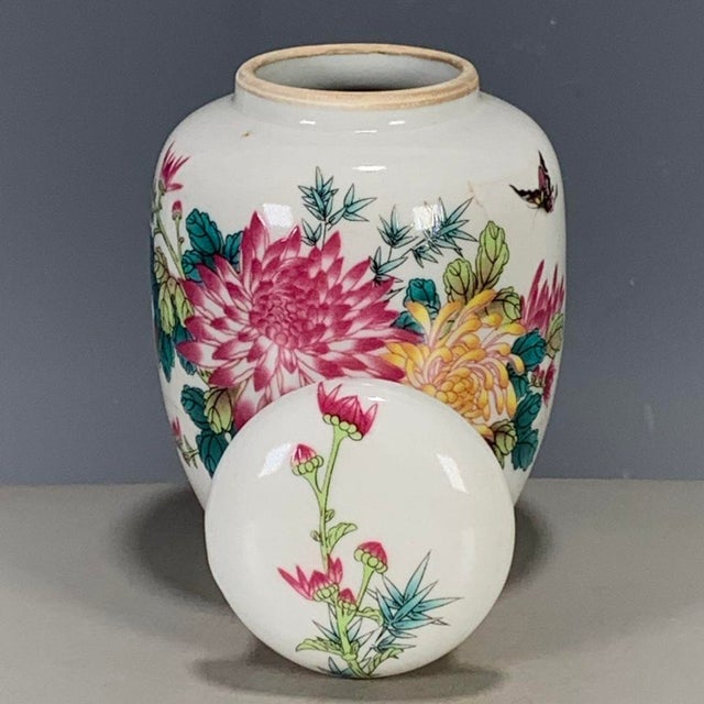 This is a charming vintage Chinese porcelain tea jar, decorated in the famille rose palette with vibrant polychrome...