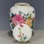 This is a charming vintage Chinese porcelain tea jar, decorated in the famille rose palette with vibrant polychrome...