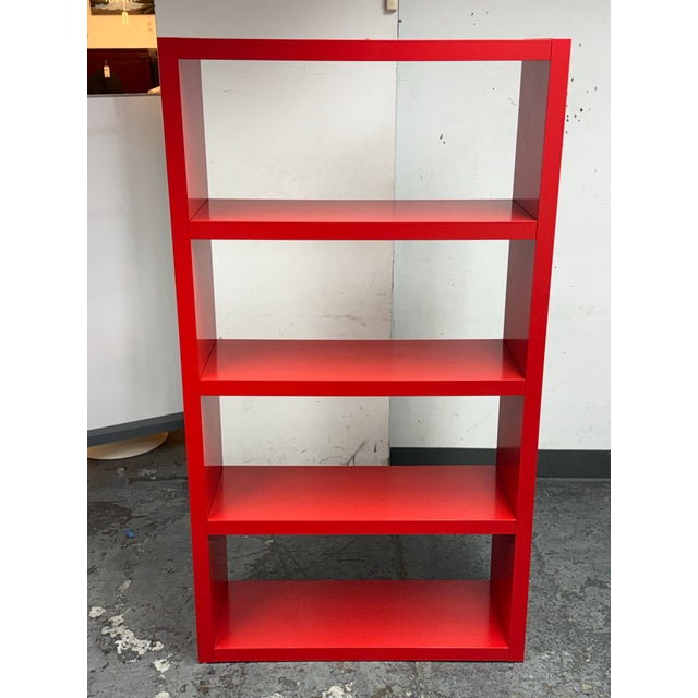 Design Plus Gallery presents the Kallax Laminated Bookshelf in Red from Ikea. This open shelving unit offers a bold...