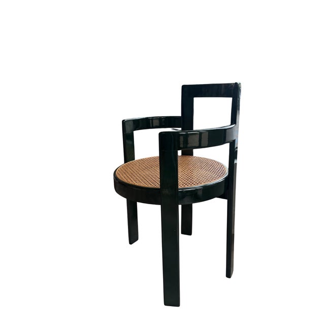 Round cane seat accent chair with dark lacquer green finish. This classic meets modern chair fits well as a corner accent...