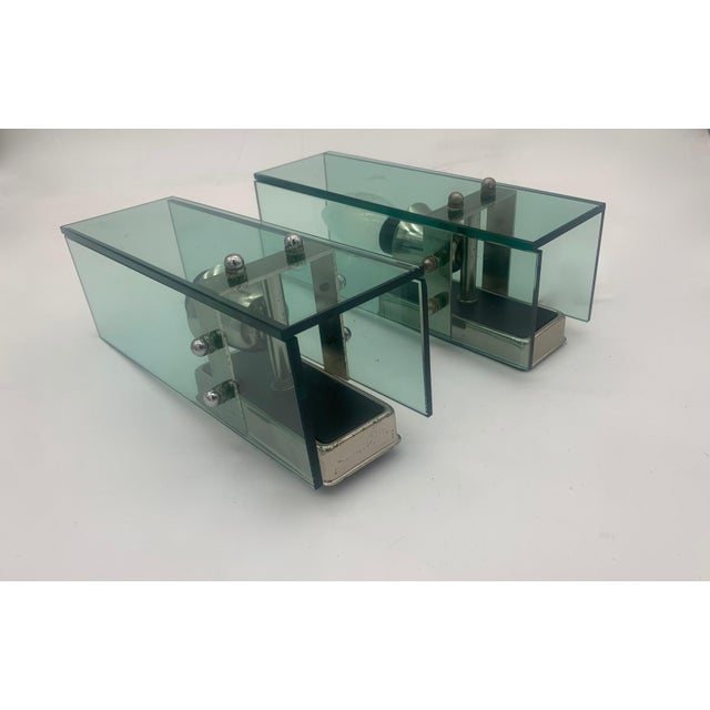 Designer wall light from around 1960, Veca brand. pair of wall sconces with a modern and geometric style, composed of...