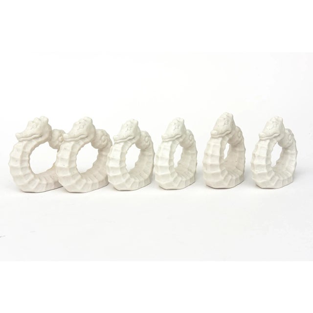 These charming vintage 1960's white bisque porcelain napkin rings are still in their original vintage box and never used....