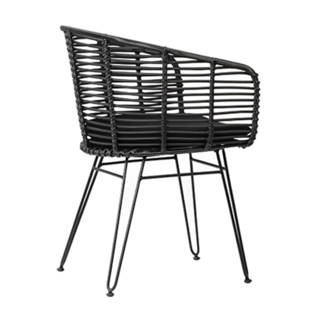 Modern all black dining chair with powder coated iron frame and hand woven faux rattan around back and seat. Comfy loose...