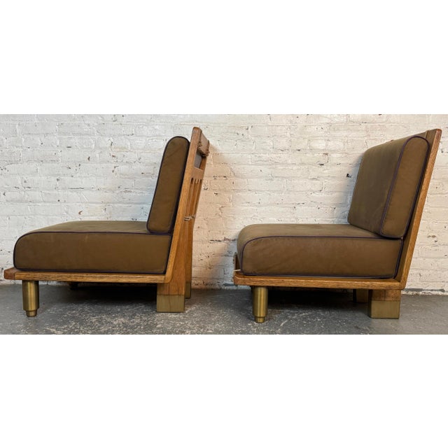 Pair of French Mid-Century oak lounge chairs designed by Robert Guillarme and Jacques Chambron for their Votre Maison...