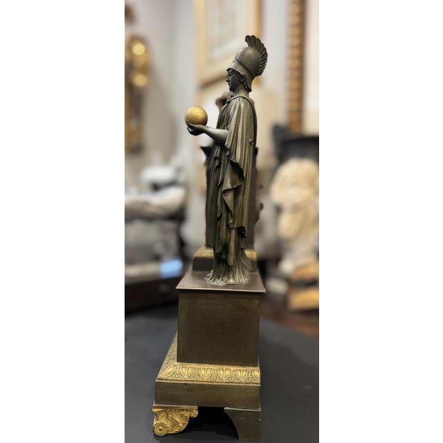 An exceptional French Restoration mantel clock depicting Athena (Minerva), goddess of wisdom, strategy, learning, and the...