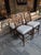 Four brand new, never used Woodbridge Merrion Counter Stools that features a pierced geometric fretwork back, an...