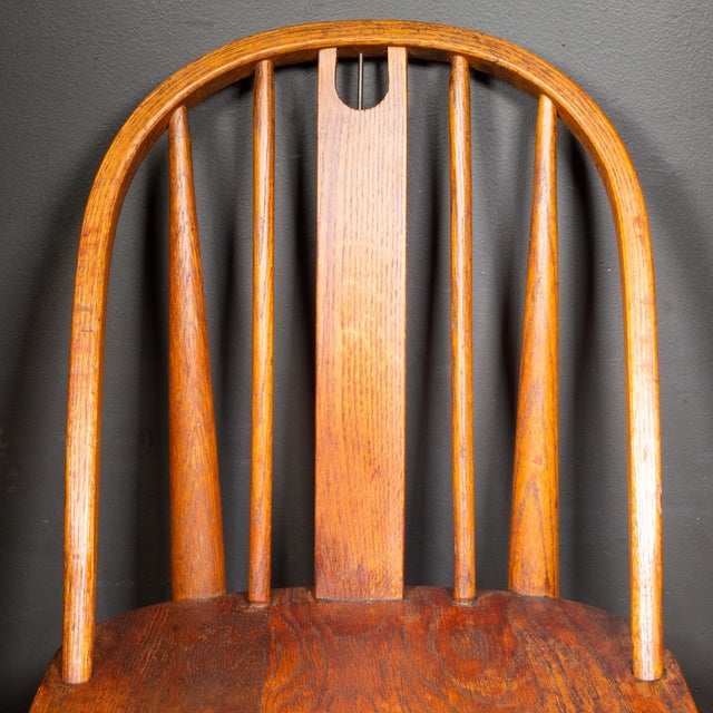 ABOUT A solid oak World War II-era medical field chair stamped with military property markings form the United States...