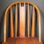 ABOUT A solid oak World War II-era medical field chair stamped with military property markings form the United States...
