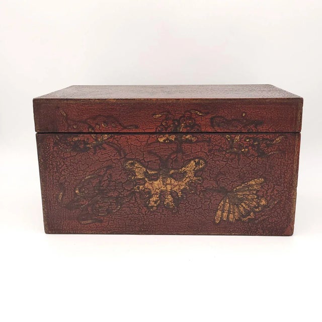 A 19th-century Chinese lacquered box with gilt decoration.