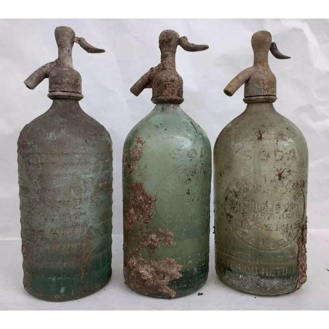 This beautiful old Lourdes red seltzer bottle displays the history of Argentina's love affair with seltzer. In Argentina,...