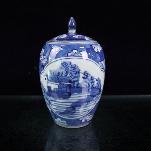 A charming small Chinese blue and white porcelain covered jar. The jar features a traditional landscape scene with...