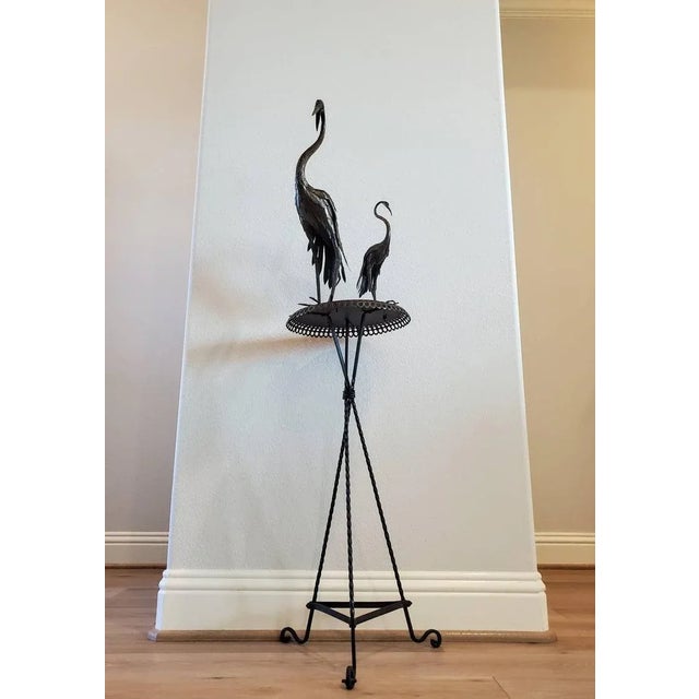 A whimsical and most unusual hand-crafted iron and bronze crane figure statue table. circa 1940s Dating to the mid-20th...