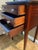 Elegant mahogany nightstand has a dark reddish-brown finish with decorative light wood string inlay on the top and drawer...