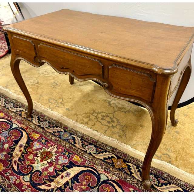 Elegant antique French desk, beautifully crafted in the provincial style. The gracefully curved serpentine front and...