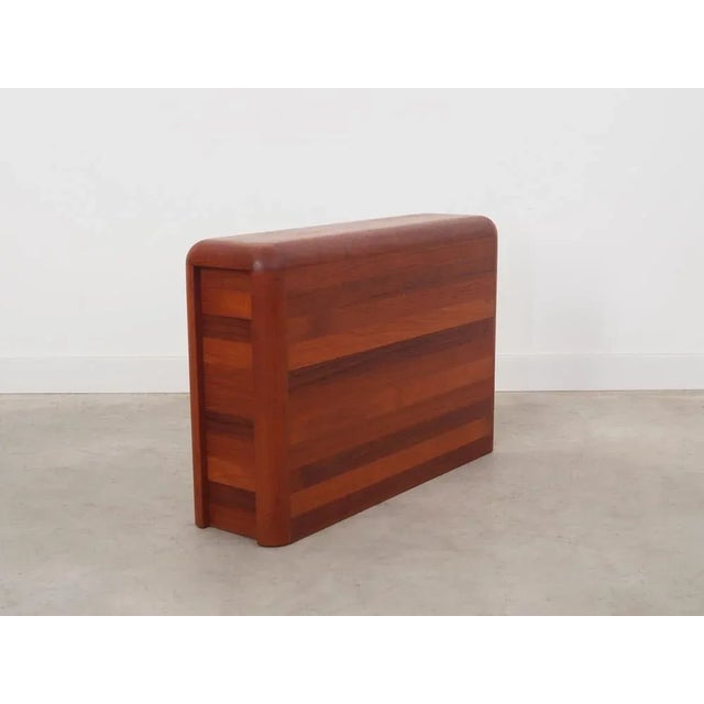 The newspaper holder was made in the 1970s, Danish production. The structure was made of solid teak wood. The surface has...