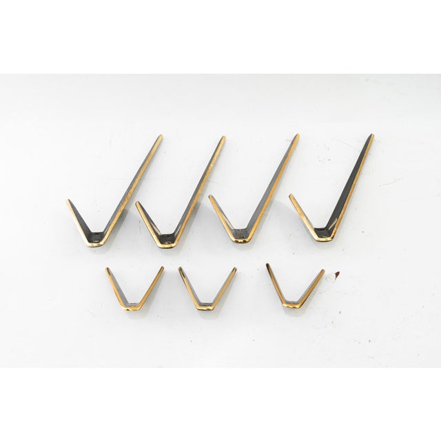 7 hooks by Herta Baller, Vienna around 1950s Bigger ones: Height: 17cm Width: 12cm Depth: 8cm Smaller ones: Height: 7cm...