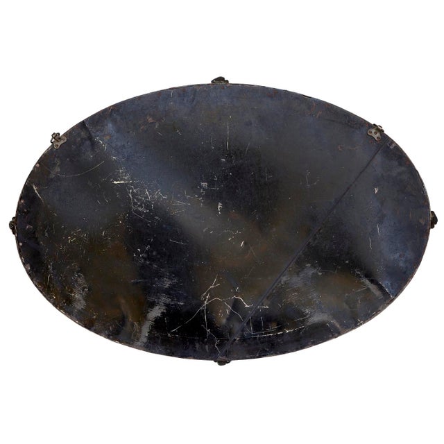 An Unusual, Antique Arts & Crafts Metal Hammered Oval Beveled Mirror from about 1890's-1900 England. It has Metal details...