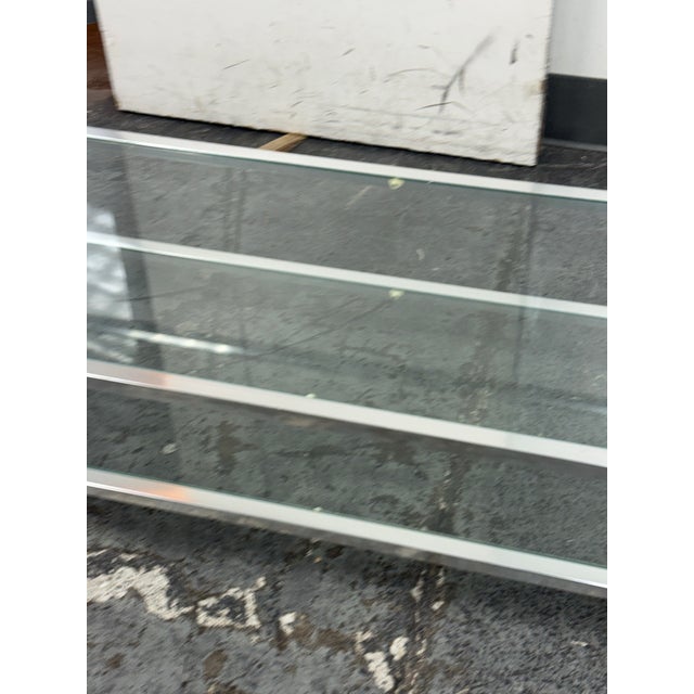 Design Plus Gallery presents a Mid 20th Century Metal + Glass Coffee Table from Maison Jansen. The rectangular coffee...