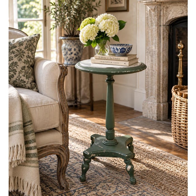 A charming Victorian marble top drinks table crafted in walnut and painted in antiqued light green. The elegant turned and...