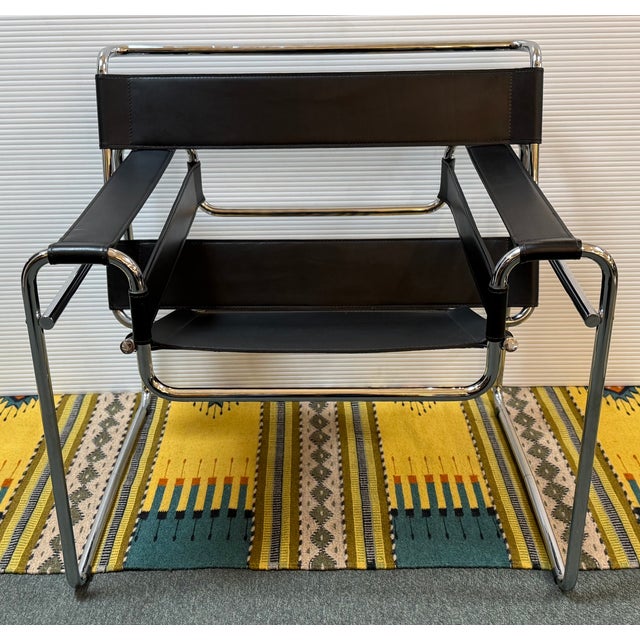 Design Plus Gallery presents a Reproduction of the Leather + Chrome Wassily Chair. Experience the epitome of modernist...