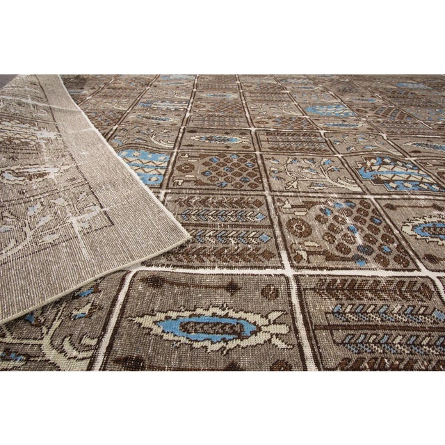 This beautiful vintage distressed Persian Tabriz hand-knotted design rug will make your floor look splendid. This...