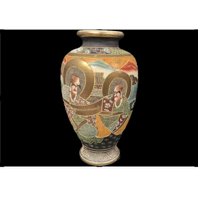 Japanese Satsuma Moriage Vase with Gilded Enamels. Vase features elegant proportions with a gently tapering form and is...
