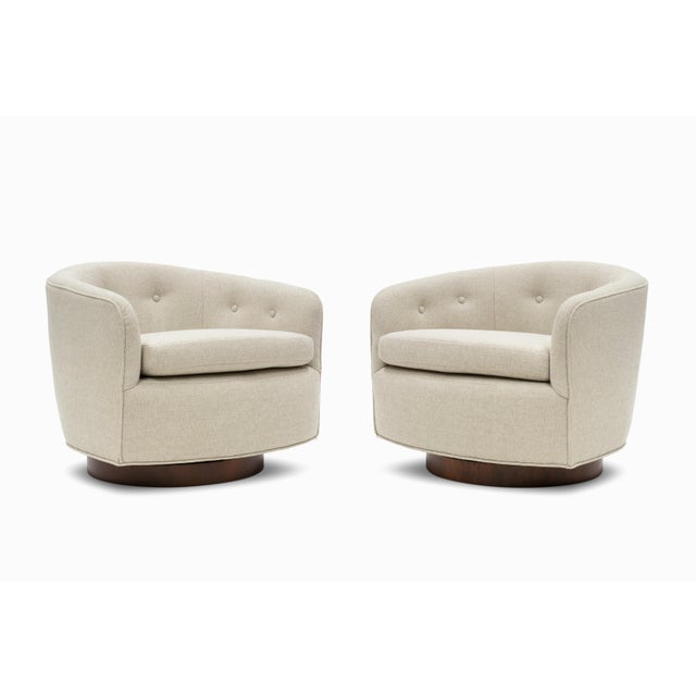 Here is a pair of lovely swivel chairs attributed to Milo Baughman, circa 1970s. These cozy barrel back chairs feature...