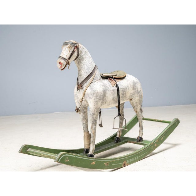 Antique Wooden Rocking Horse – Vintage Toy with Authentic Patina We offer an antique wooden rocking horse in original,...