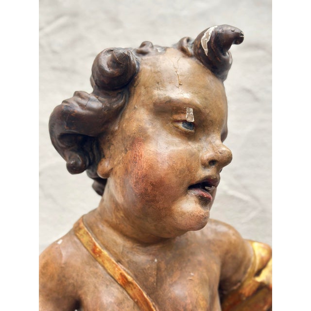 Large Putto, Southern Germany / Tyrol, c. 1750 Wood carving Dimensions: 79 x 55.5 x 24.5 cm paint in places damaged (see...