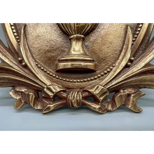 Stunning, neoclassical medallion made of polished bronze circa the early 20th century. Gorgeous design features a detailed...
