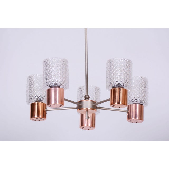 This magnificent five-arm chandelier, originating from the 1960s from Czechoslovak production, represents an exemplary...