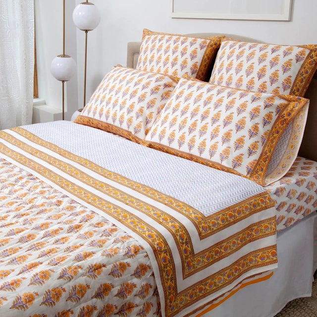 The Juhi flower design depicts a typical Indian flower motif in warm yellow tones with accents in cool periwinkle. This...