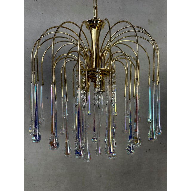 Very beautiful vintage teardrop chandelier. Design: Massive. Murano tiles in excellent condition. 1970s. The mother-of-...
