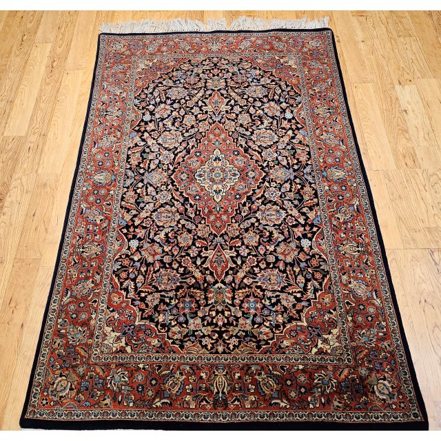"An exquisite vintage Persian Kashan area rug from the third quarter of the 20th century, showcasing the celebrated garden...