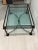 Kellogg Collection Iron and Glass Coffee Table A stately and substantial two tier coffee table with a wrought iron base,...